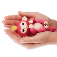 Fingerlings Mono interactivo - Bella (rosa con el pelo amarillo)